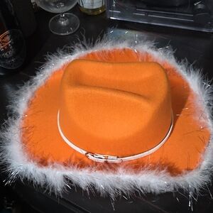Orange Cowboy Hat with White Feather Trim